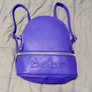Gently used purple BEBE backpack purse.